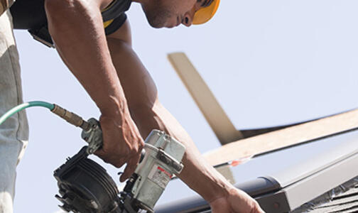 Construction Worker Working on Roofing Thumbnail